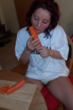 shoving a carrot up her box