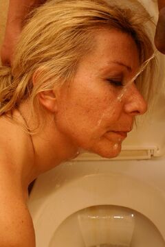 She swallows and fucks on a crapper