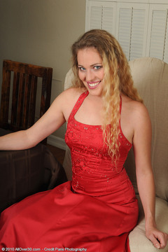 Elegant and blonde Daisy L in and out of a sexy red dress