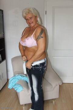 Blonde chubby mature slut showing off her rack