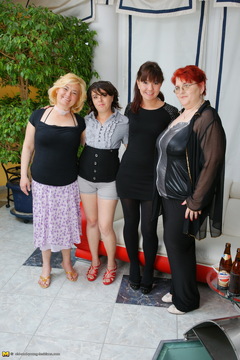 Four old and young lesbians having a party