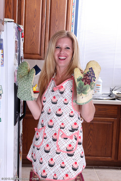 Gorgeous housewife Gail gets things heated right up in the kitchen