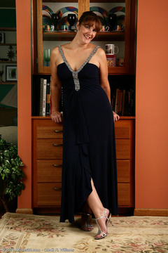 35 year old redheaded Julie slips out of her elegant dress and spreads