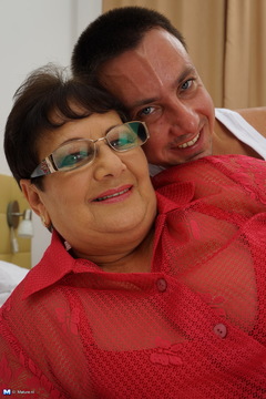 Naughty big mama playing with her toy boy