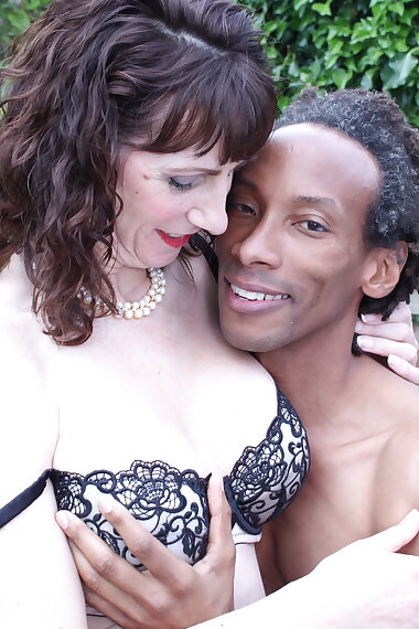 British mom fooling around with a black guy in her garden